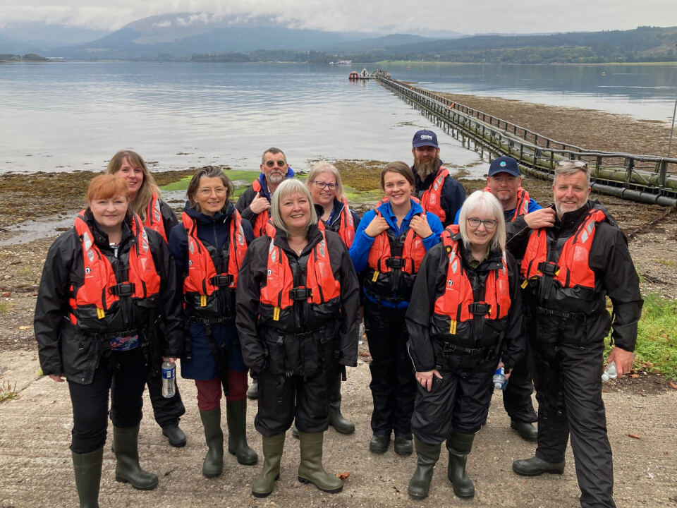 MSPs and representatives from Scottish salmon farming at Scottish Sea Farms’ South Shian pier by Loch Creran, near Oban. The MSPs are at the front, and are, from left: Emma Harper, Emma Roddick (behind Harper), Arianne Burgess, Rhoda Grant, deputy convener Beatrice Wishart and convenor Finlay Carson.