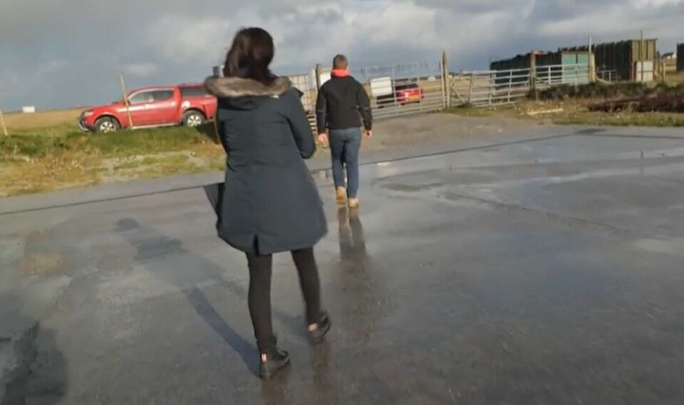 Cockleshell cheerio: ITV reporter Louise Scott is led to the exit by Fraser Macdonald after he and Angus Macdonald bring the interview to an end.