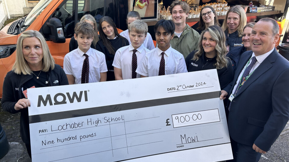 Mowi Scotland's community engagement officer Jayne Mackay, left, and human resources manager Sarah Ralston, front right, hand over a cheque for £900 to Lochaber High School head teacher Scott Steele.