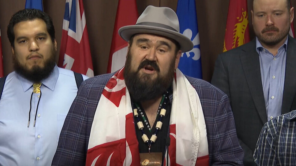 Dallas Smith, centre, with Isaiah Robinson, deputy chief councillor for the Kitasoo Xai'xais First Nation, left, and Cermaq Canada managing director David Kiemele at today's press conference.