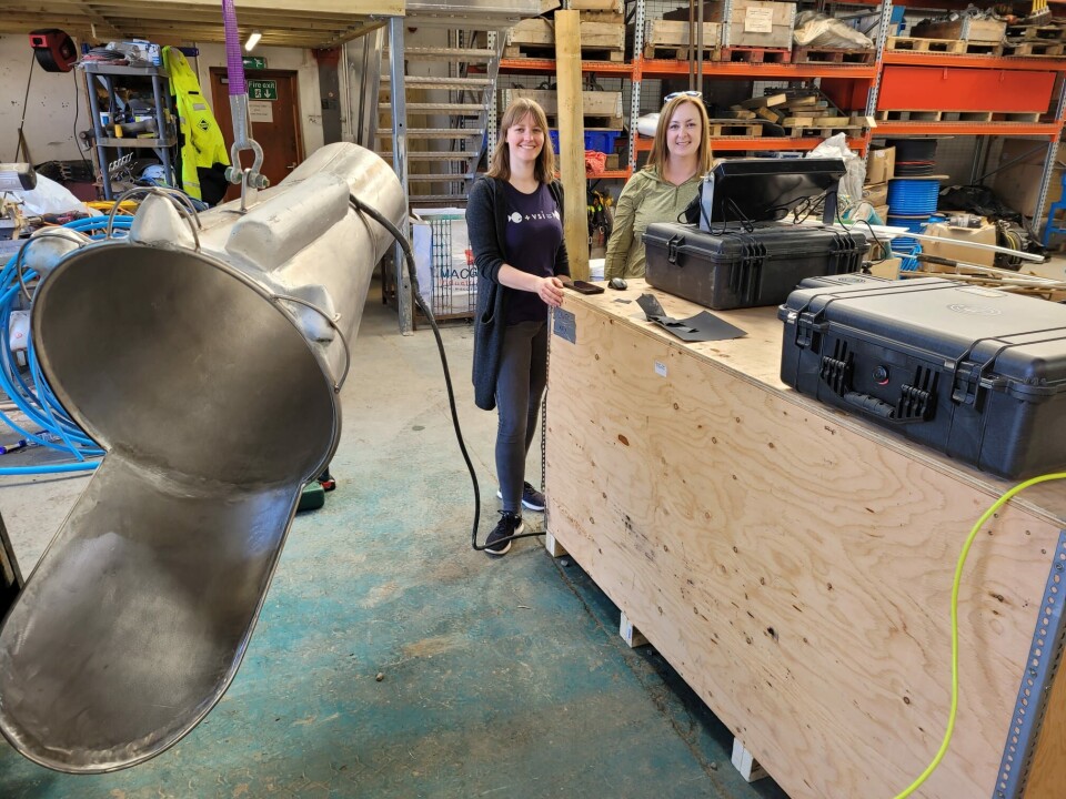 ECI research director Julia Voss, left, and corporate development director Siobhan Neil with a traditional suction bell that was modified to add embedded cameras for video and data collection. Voss, Neil, and manufacturing director Max Falkjar used the bell on a field trip to Scotland to collect baseline data from a harvest on a farm site.