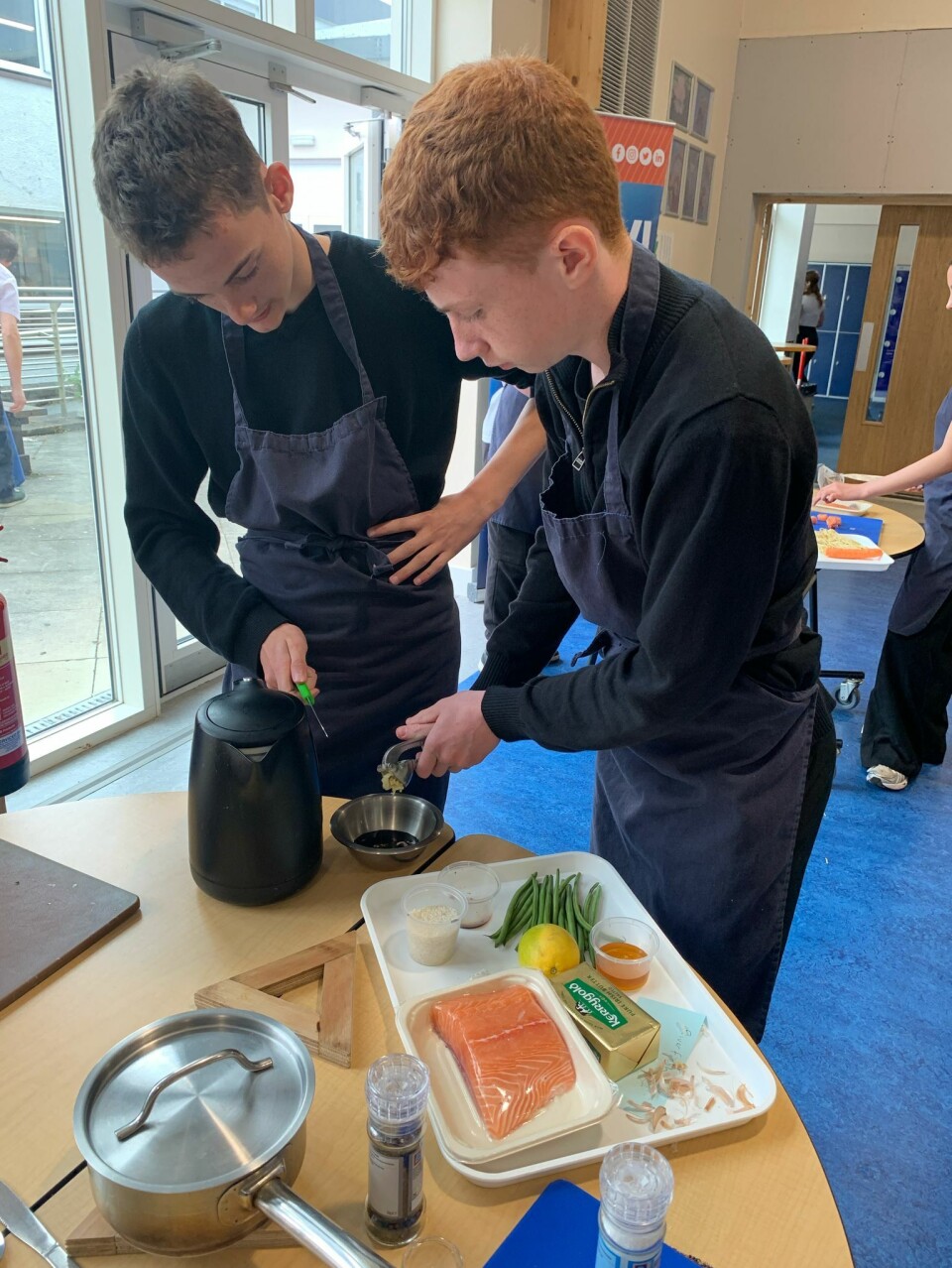 Pupils at work in a competition to devise their own salmon dish, packaging concept, and marketing campaign.