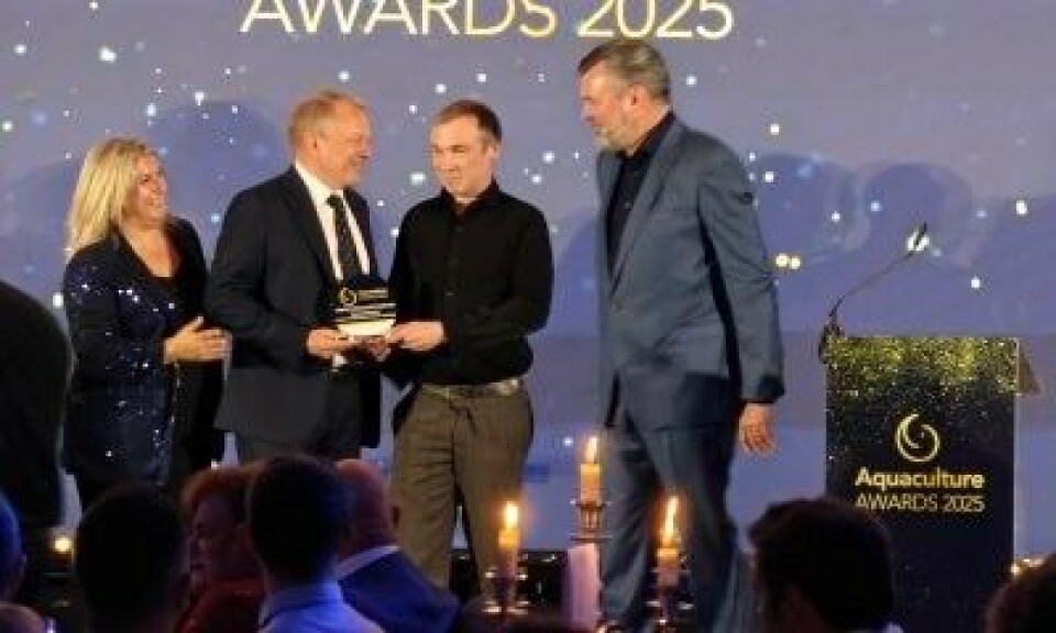 Dave Little receives the Judges' award from Carsten Holm of event organiser Diversified Communications, watched by Diversified's Cheri Arvonio and compere Grant Stott.
