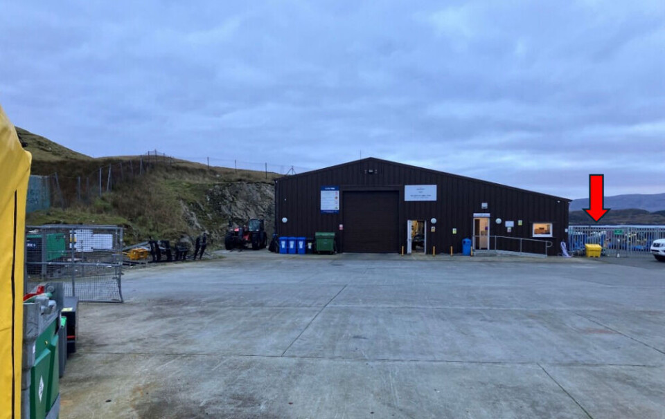 Bakkafrost's Cuddy Point shore base. The red arrow points to where the temporary accommodation will be sited.