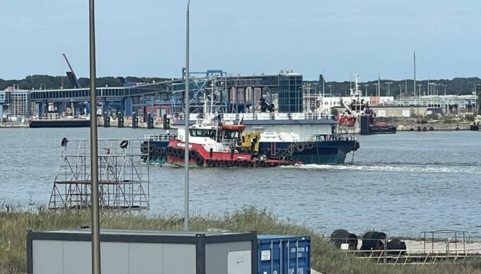 The feed barge is being towed from Poland to the Faroe Islands