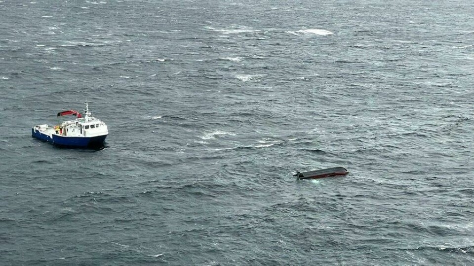 The capsized RIB. Its crew lay in the sea for half an hour. Photo: Florø rescue helicopter.
